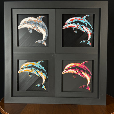 Four-panel framed geometric dolphin layered 3D art set showing the dolphin design in Heritage, Crimson Ice, Royal Gold, and Teal Orange color palettes inside a charcoal matte four-pack display frame.
