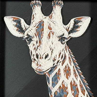 Geometric giraffe framed layered 3D art in Heritage color palette, featuring a bold giraffe portrait with soft white, gray, black, and neutral brown layered details inside a charcoal matte display frame.