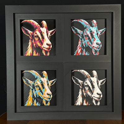 Four-panel framed geometric goat layered 3D art set showing the goat design in Heritage, Crimson Ice, Royal Gold, and Teal Orange color palettes inside a charcoal matte four-pack display frame.