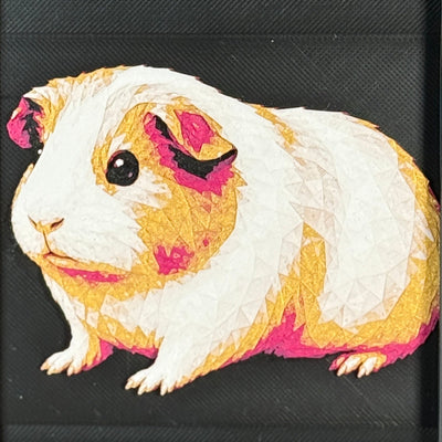 Geometric guinea pig framed layered 3D art in Royal Gold color palette, featuring a guinea pig portrait with gold, blue, black, and white layered details inside a charcoal matte display frame.
