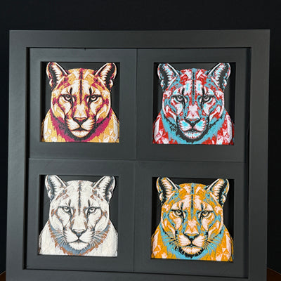 Four-panel framed geometric mountain lion layered 3D art set showing the mountain lion design in Heritage, Crimson Ice, Royal Gold, and Teal Orange color palettes inside a charcoal matte four-pack display frame.