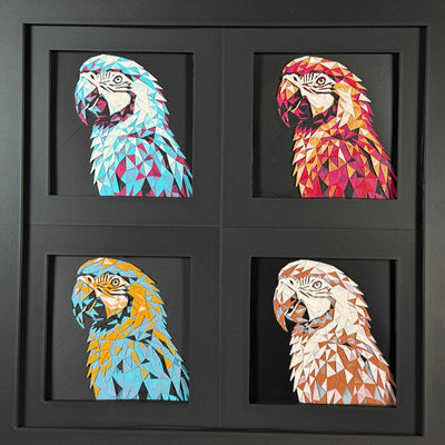 Four-panel framed geometric capybara layered 3D art set showing the Parrot design in Heritage, Crimson Ice, Royal Gold, and Teal Orange color palettes inside a charcoal matte four-pack display frame.