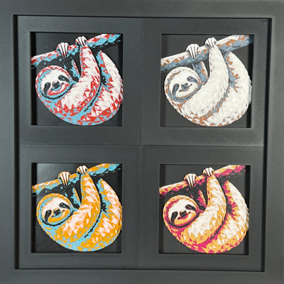 Four-panel framed geometric sloth layered art set showing the same hanging sloth design in four WTX3D color palettes, arranged in a charcoal black 2x2 frame with detailed fur texture, curved branch pose, and high-contrast layered color.