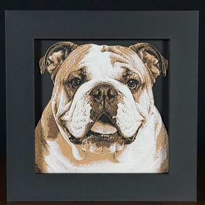 Framed 3D layered art piece featuring a highly detailed, textured portrait of an English Bulldog dog with a characterful wrinkled face, expressive eyes, and a brown and white coat pattern.