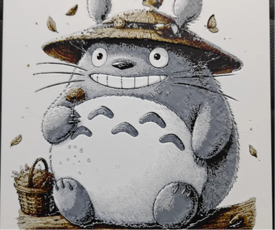 Framed 3D layered art piece featuring a detailed illustration of a large, round gray forest creature wearing a small straw hat, set against a light textured background.