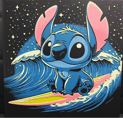 Framed 3D layered art piece featuring an adorable illustration of a cute blue alien character sitting patiently on a yellow and pink surfboard, riding a large, stylized curling blue ocean wave under a dark night sky filled with stars.