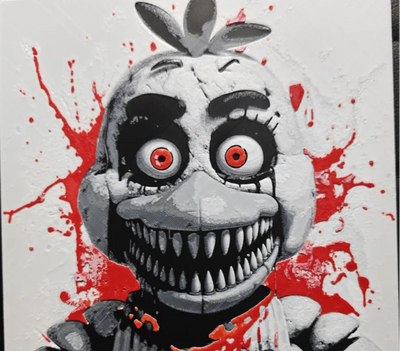 Framed 3D layered art piece featuring a creepy animatronic chicken creature with wide orange eyes and multiple rows of sharp teeth, accented with red splatter details on a light background.