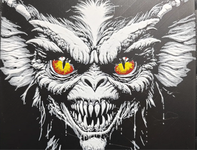 Monster face horror framed layered 3D art with red and yellow eyes