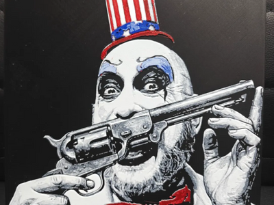 Framed 3D layered art piece featuring a detailed portrait of a creepy horror movie killer clown with smeared white and black face paint, baring his teeth while wearing a patriotic red, white, and blue stars-and-stripes top hat.