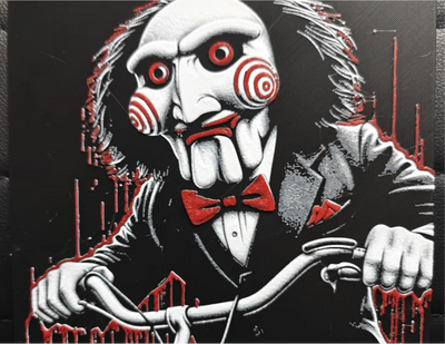 Saw puppet horror framed layered 3D art with red spiral cheeks and bow tie
