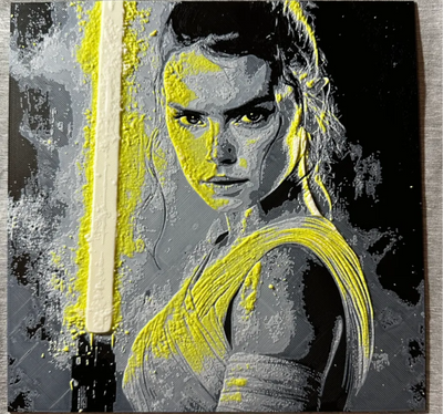 Framed 3D layered art piece featuring a striking, high-contrast stylized illustration of a determined sci-fi heroine looking over her shoulder. Vibrant, heavily textured bright yellow accents highlight her face, clothing, and a prominent vertical lightsaber blade ignited on the left side, all set against a heavily textured grayscale and black paint-splattered background.