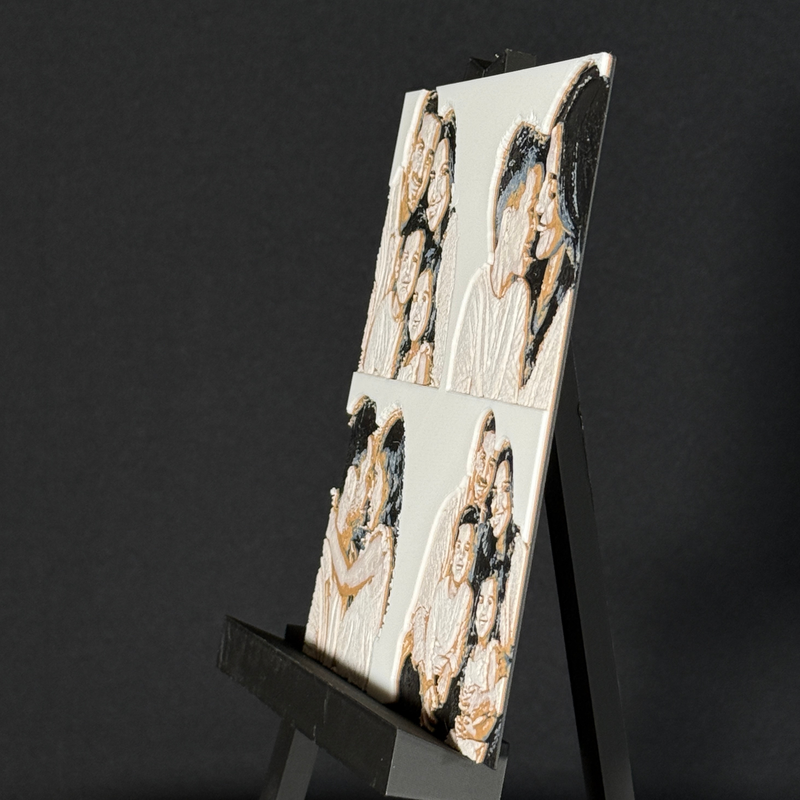 Custom framed 3D layered art piece showing a family of four, printed in layers by WTx3D.