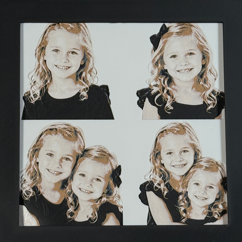 Custom framed 3D layered art piece showing two sisters, printed in layers by WTx3D.