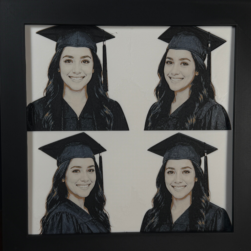 Custom framed 3D layered art piece showing a high school senior in cap and gown, printed in layers by WTx3D.