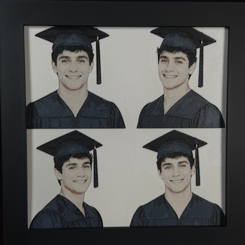 Custom framed 3D layered art piece showing a high school senior in cap and gown, printed in layers by WTx3D.