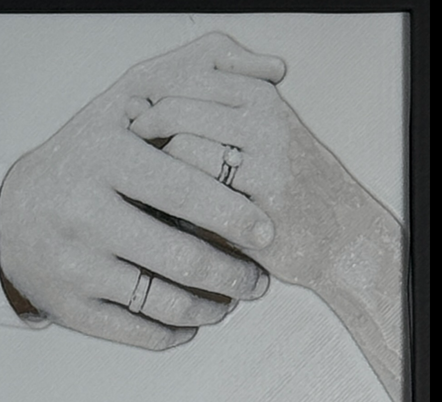 Custom framed 3D layered art piece showing a wedding couple's clasped hands with rings, printed in layers by WTx3D.