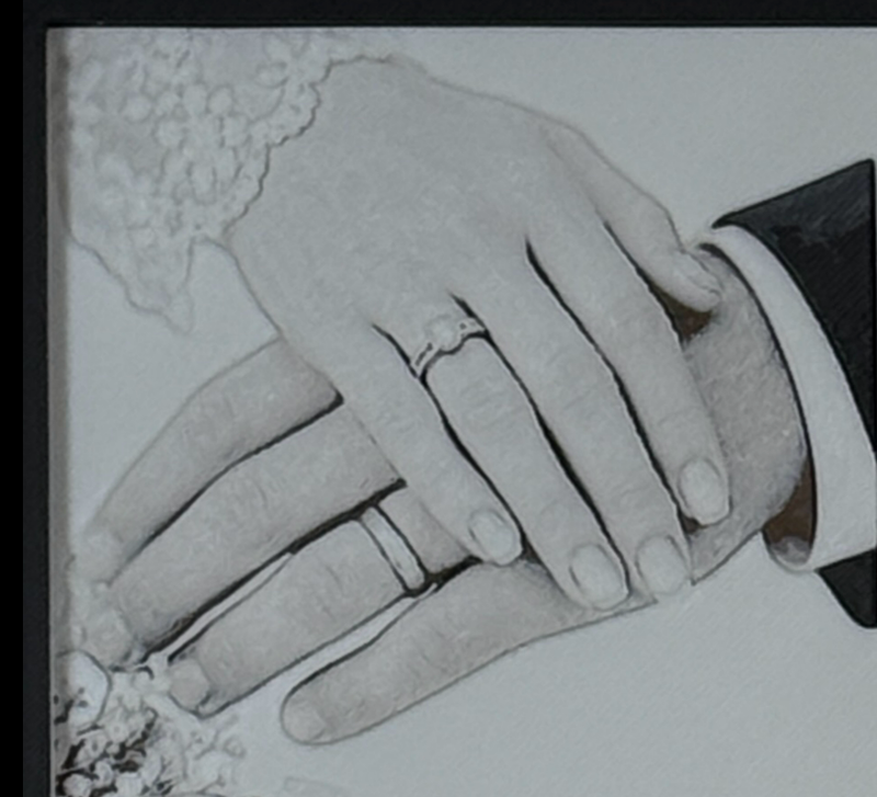 Custom framed 3D layered art piece showing a wedding couple's clasped hands with rings, printed in layers by WTx3D.