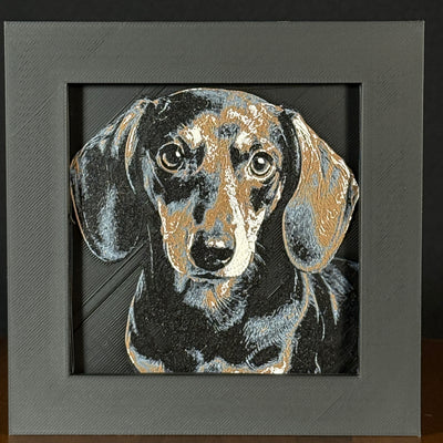 Framed 3D layered art piece featuring a highly detailed, textured portrait of a Dachshund dog with floppy ears, expressive eyes, and a black and tan coat pattern.
