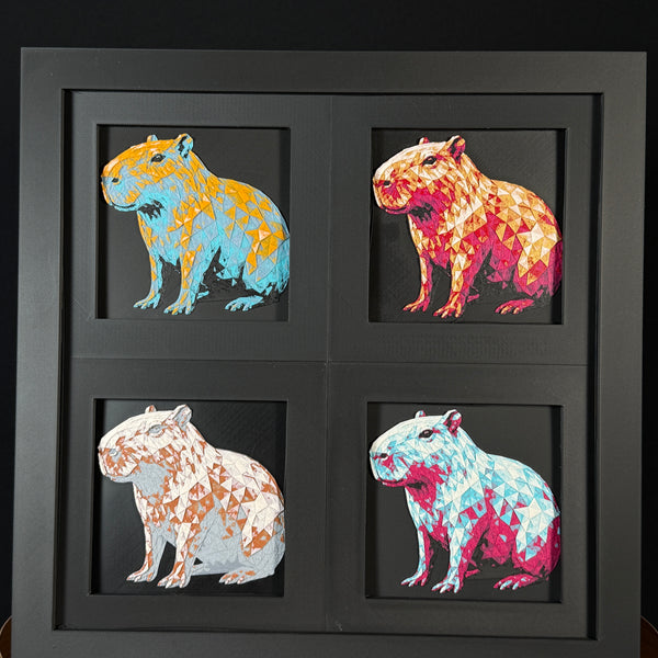 Four-panel framed geometric capybara layered 3D art set showing the capybara design in Heritage, Crimson Ice, Royal Gold, and Teal Orange color palettes inside a charcoal matte four-pack display frame.