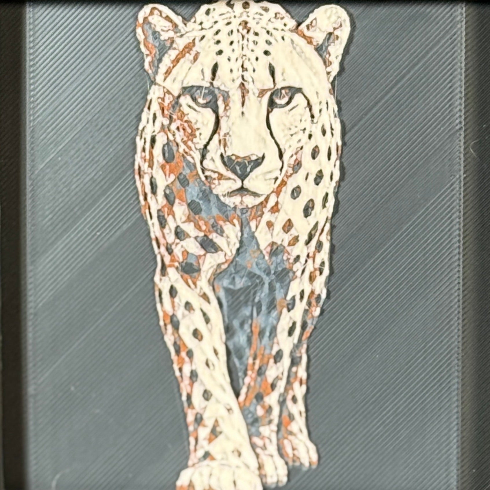Geometric cheetah framed layered 3D art in Heritage color palette, featuring a standing cheetah with soft white, gray, black, and neutral brown layered details inside a charcoal matte display frame.