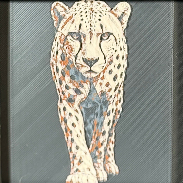 Geometric cheetah framed layered 3D art in Heritage color palette, featuring a standing cheetah with soft white, gray, black, and neutral brown layered details inside a charcoal matte display frame.