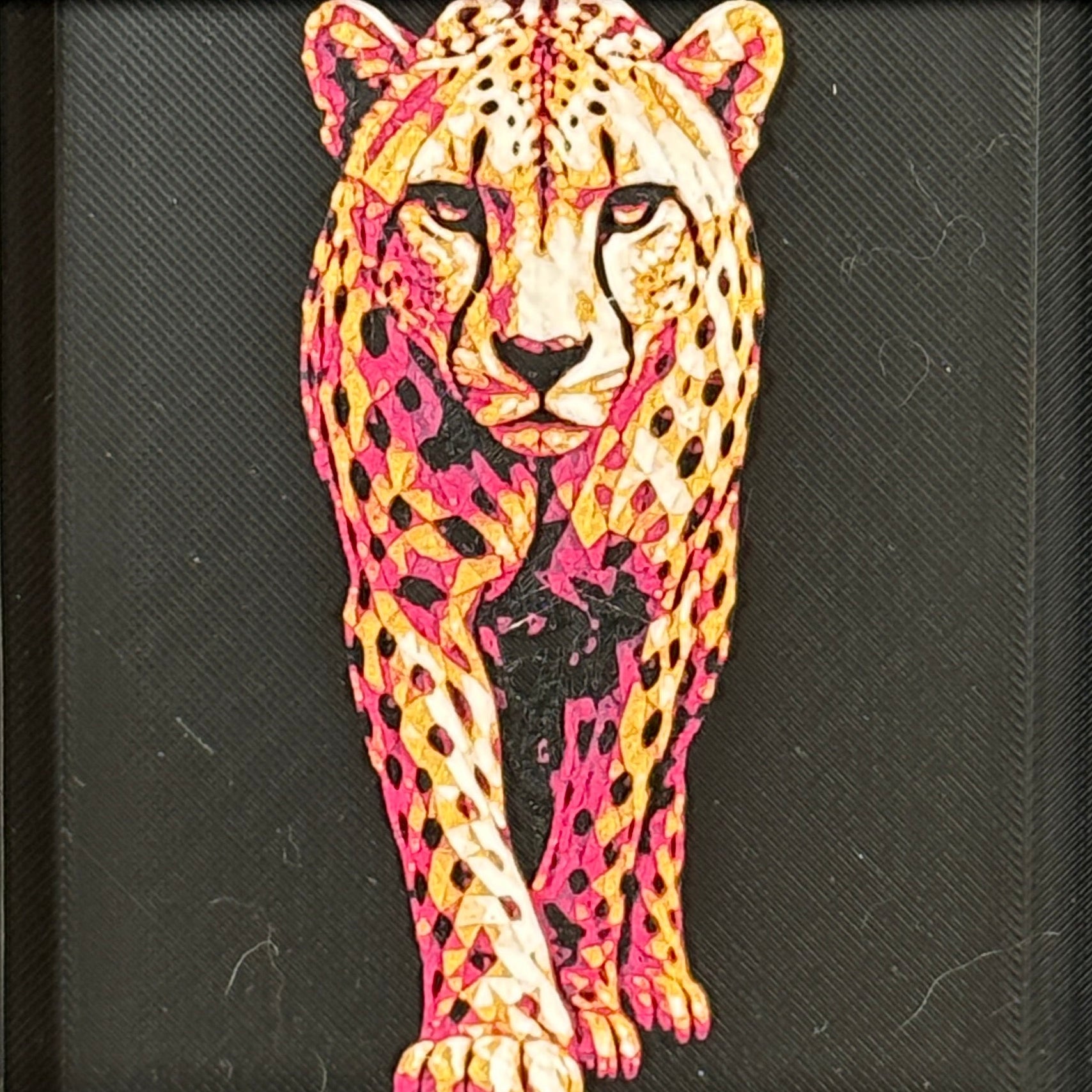 Geometric cheetah framed layered 3D art in Royal Gold color palette, featuring a standing cheetah with gold, blue, black, and white layered details inside a charcoal matte display frame.