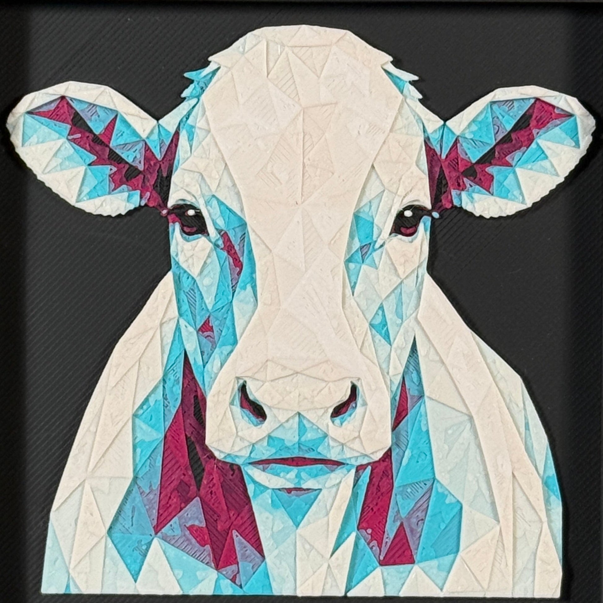 Geometric cow framed layered 3D art in Crimson Ice color palette, featuring a bold cow portrait with cyan, red, magenta, black, and white layered details inside a charcoal matte display frame.