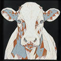 Geometric cow framed layered 3D art in Heritage color palette, featuring a bold cow portrait with soft white, gray, black, and neutral brown layered details inside a charcoal matte display frame.