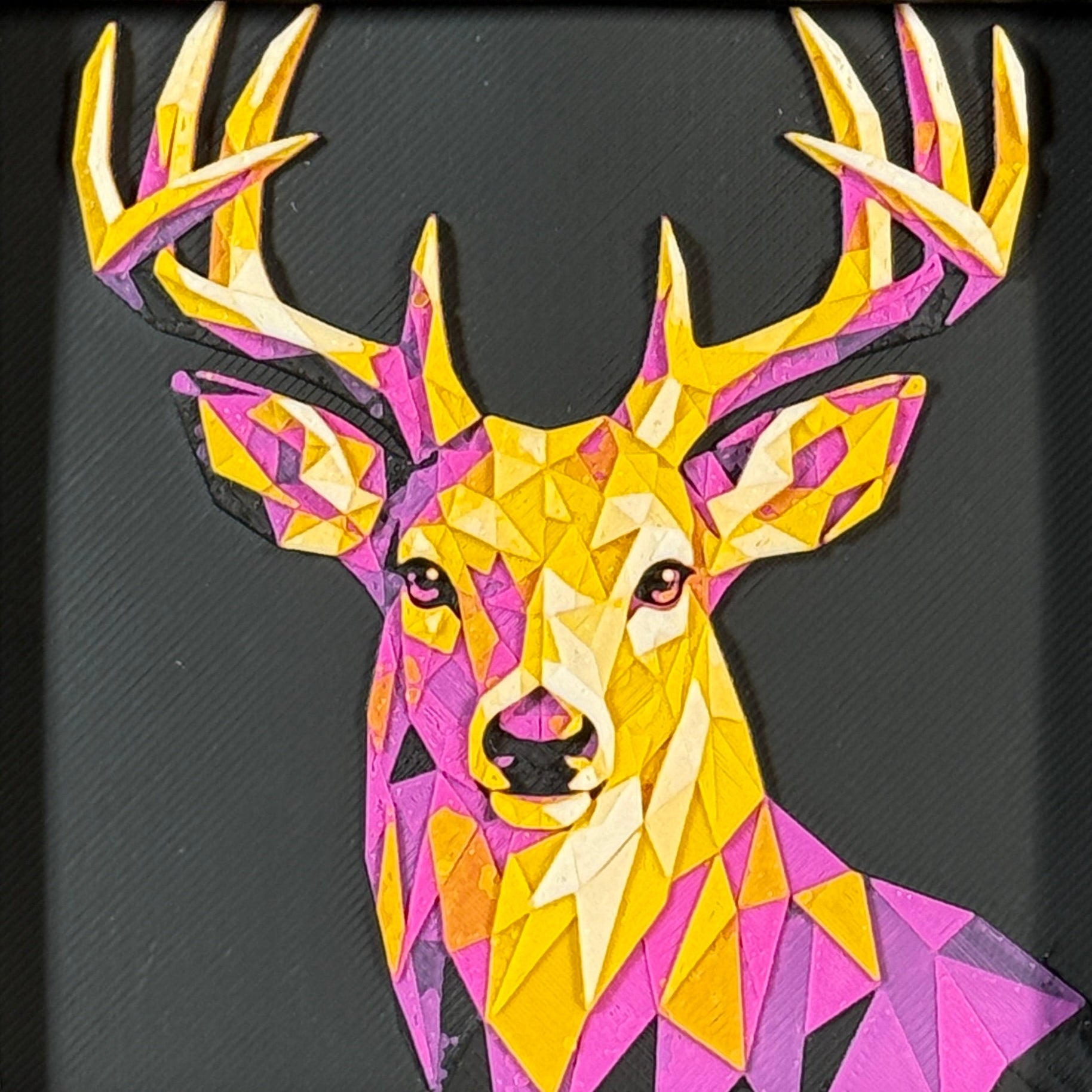 Framed geometric deer layered 3D art piece featuring a front-facing buck design in a vibrant Royal Gold color palette with bright pink, purple, and yellow tones.