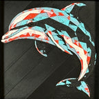 Geometric dolphin framed layered 3D art in Crimson Ice color palette, featuring a leaping dolphin with cyan, red, magenta, black, and white layered details inside a charcoal matte display frame.