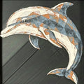 Geometric dolphin framed layered 3D art in Heritage color palette, featuring a leaping dolphin with soft white, gray, black, and neutral brown layered details inside a charcoal matte display frame.