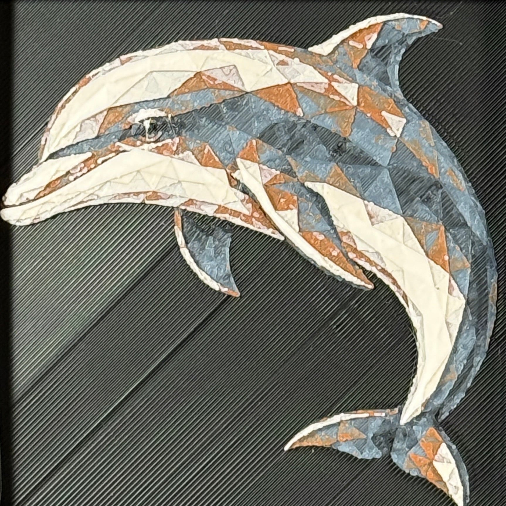 Geometric dolphin framed layered 3D art in Heritage color palette, featuring a leaping dolphin with soft white, gray, black, and neutral brown layered details inside a charcoal matte display frame.