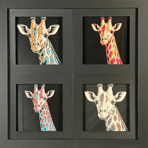 Four-panel framed geometric giraffe layered 3D art set showing the giraffe design in Heritage, Crimson Ice, Royal Gold, and Teal Orange color palettes inside a charcoal matte four-pack display frame.