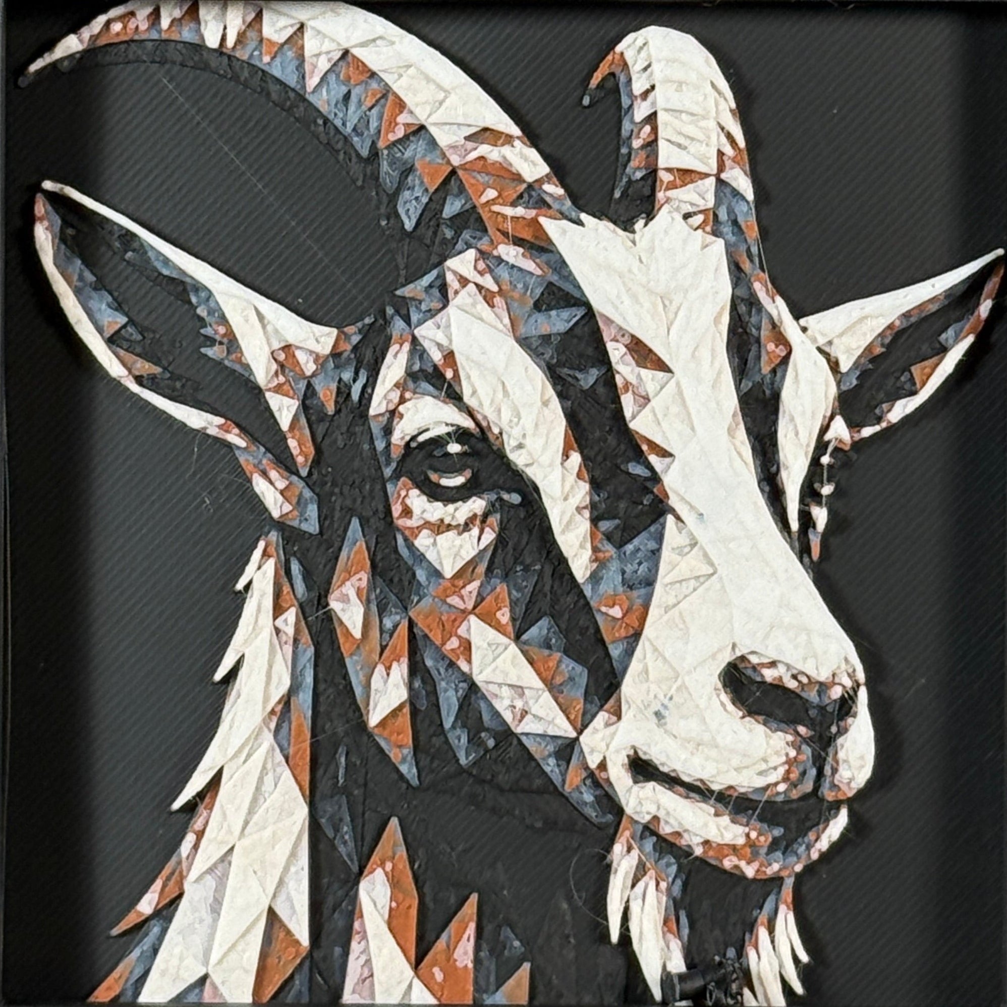 Geometric goat framed layered 3D art in Heritage color palette, featuring a bold goat portrait with soft white, gray, black, and neutral brown layered details inside a charcoal matte display frame.