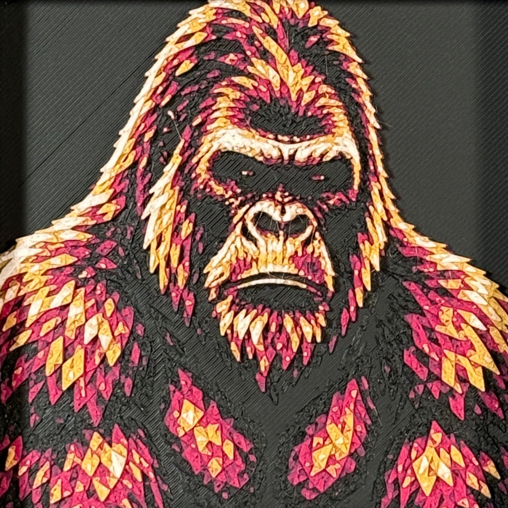 Geometric gorilla framed layered 3D art in Royal Gold color palette, featuring a bold gorilla portrait with gold, blue, black, and white layered details inside a charcoal matte display frame.