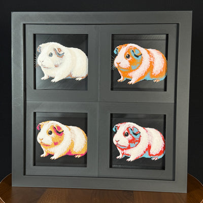 Four-panel framed geometric guinea pig layered art set showing the same guinea pig design in four WTX3D color palettes, arranged in a charcoal black 2x2 frame with rounded body shape, detailed fur texture, and high-contrast layered color.