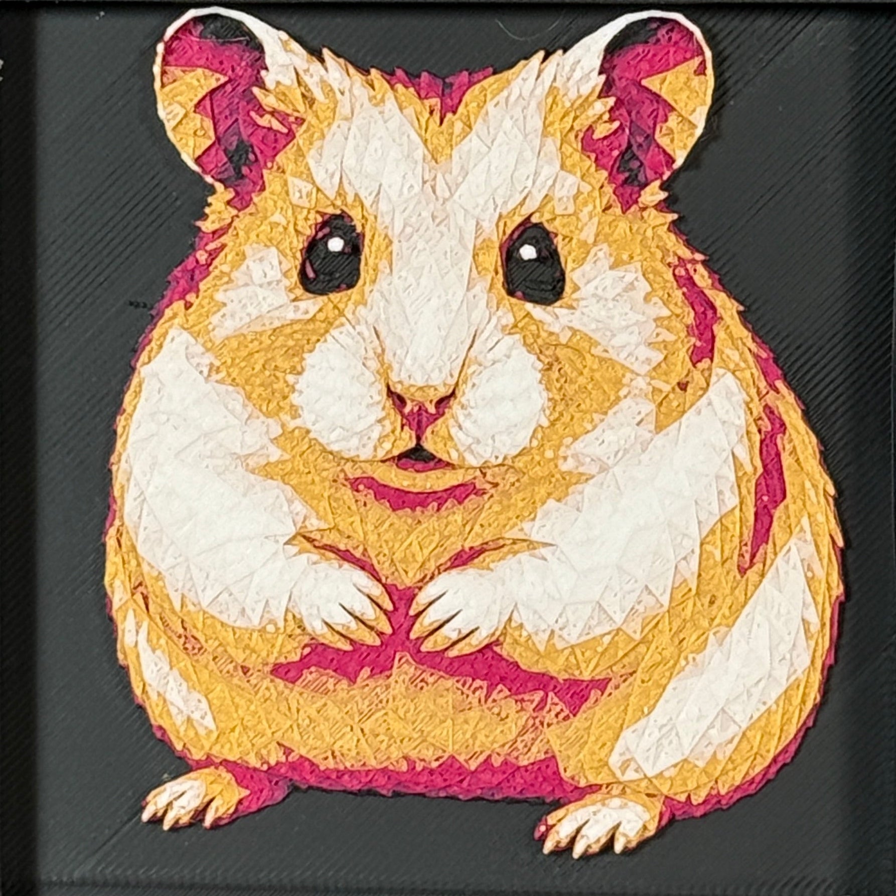 Geometric hamster framed layered 3D art in Royal Gold color palette, featuring a hamster portrait with gold, blue, black, and white layered details inside a charcoal matte display frame.