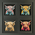 Four-panel framed geometric highland cow layered 3D art set showing the highland cow design in Heritage, Crimson Ice, Royal Gold, and Teal Orange color palettes inside a charcoal matte four-pack display frame.