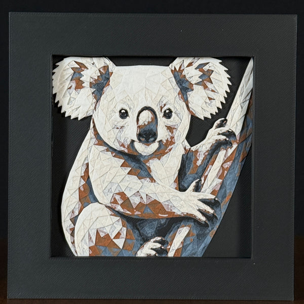 Geometric koala framed layered 3D art in Heritage color palette, featuring a bold cow portrait with soft white, gray, black, and neutral brown layered details inside a charcoal matte display frame.