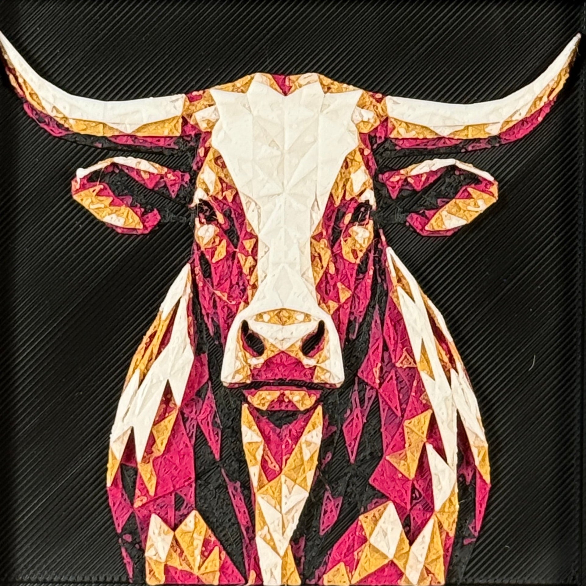 Geometric longhorn framed layered 3D art in Royal Gold color palette, featuring a bold steer portrait with gold, blue, black, and white layered details inside a charcoal matte display frame.