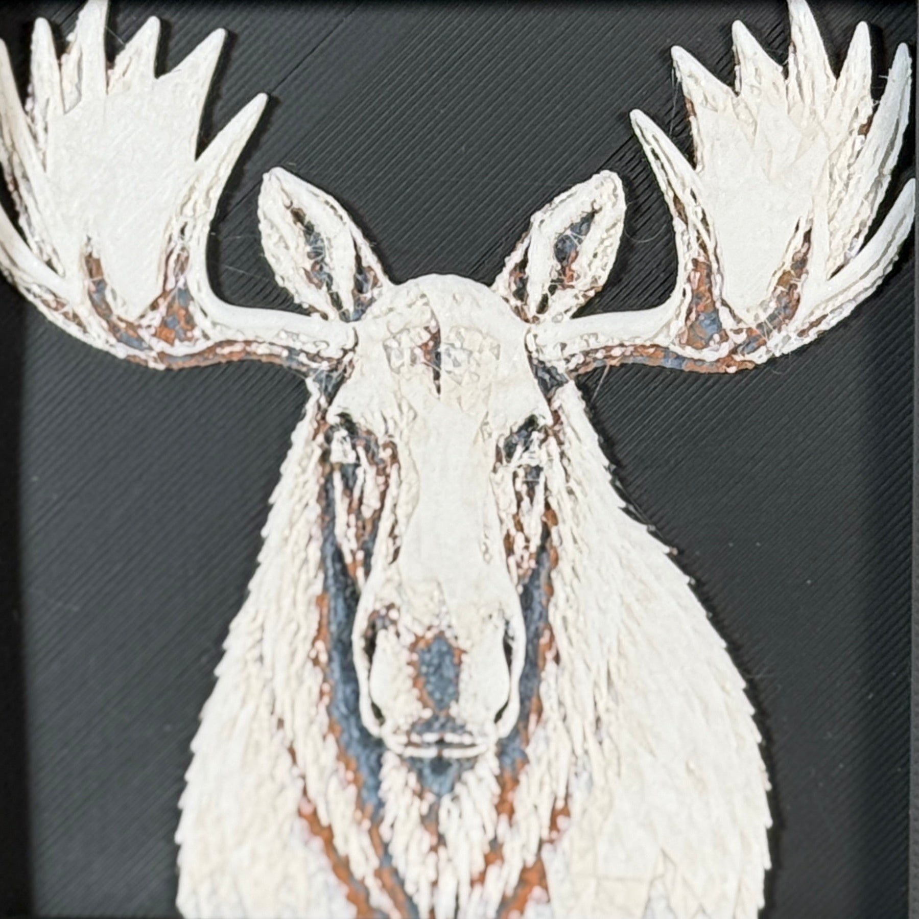 Geometric moose framed layered 3D art in Heritage color palette, featuring a bold moose portrait with soft white, gray, black, and neutral brown layered details inside a charcoal matte display frame.