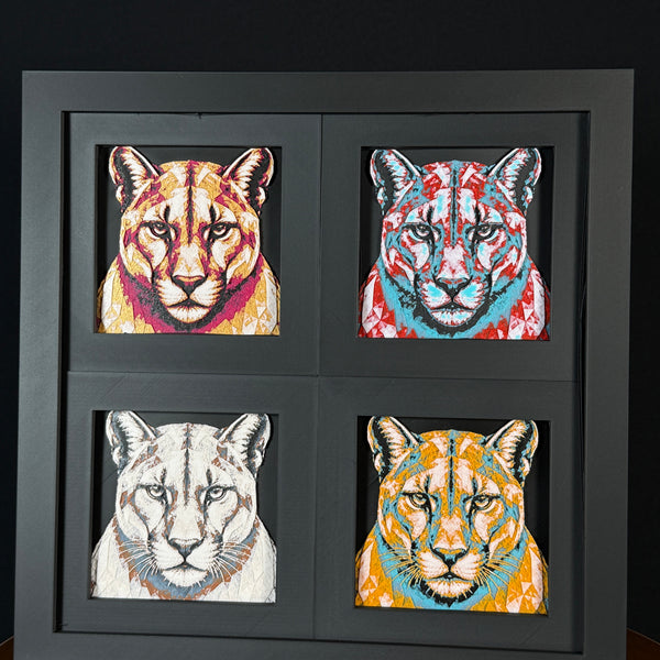 Four-panel framed geometric mountain lion layered 3D art set showing the mountain lion design in Heritage, Crimson Ice, Royal Gold, and Teal Orange color palettes inside a charcoal matte four-pack display frame.