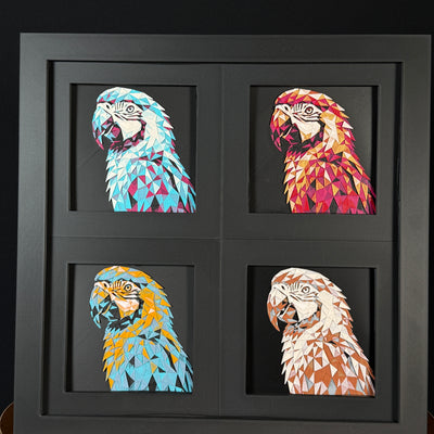 Four-panel framed geometric capybara layered 3D art set showing the Parrot design in Heritage, Crimson Ice, Royal Gold, and Teal Orange color palettes inside a charcoal matte four-pack display frame.
