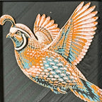 Geometric quail framed layered 3D art in Teal Orange color palette, featuring a flying quail with turquoise, orange, black, and white layered details inside a charcoal matte display frame.