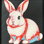 Geometric rabbit framed layered 3D art in Crimson Ice color palette, featuring a rabbit portrait with cyan, red, black, and white layered details inside a charcoal matte display frame.