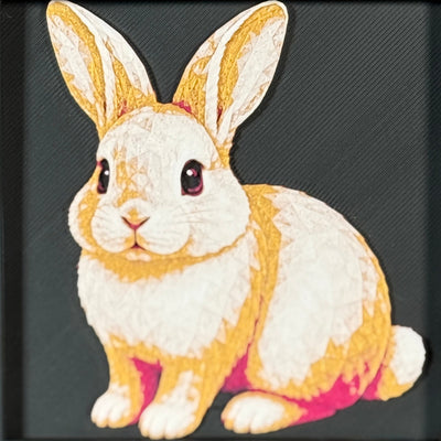 Geometric rabbit framed layered 3D art in Royal Gold color palette, featuring a rabbit portrait with gold, blue, black, and white layered details inside a charcoal matte display frame.