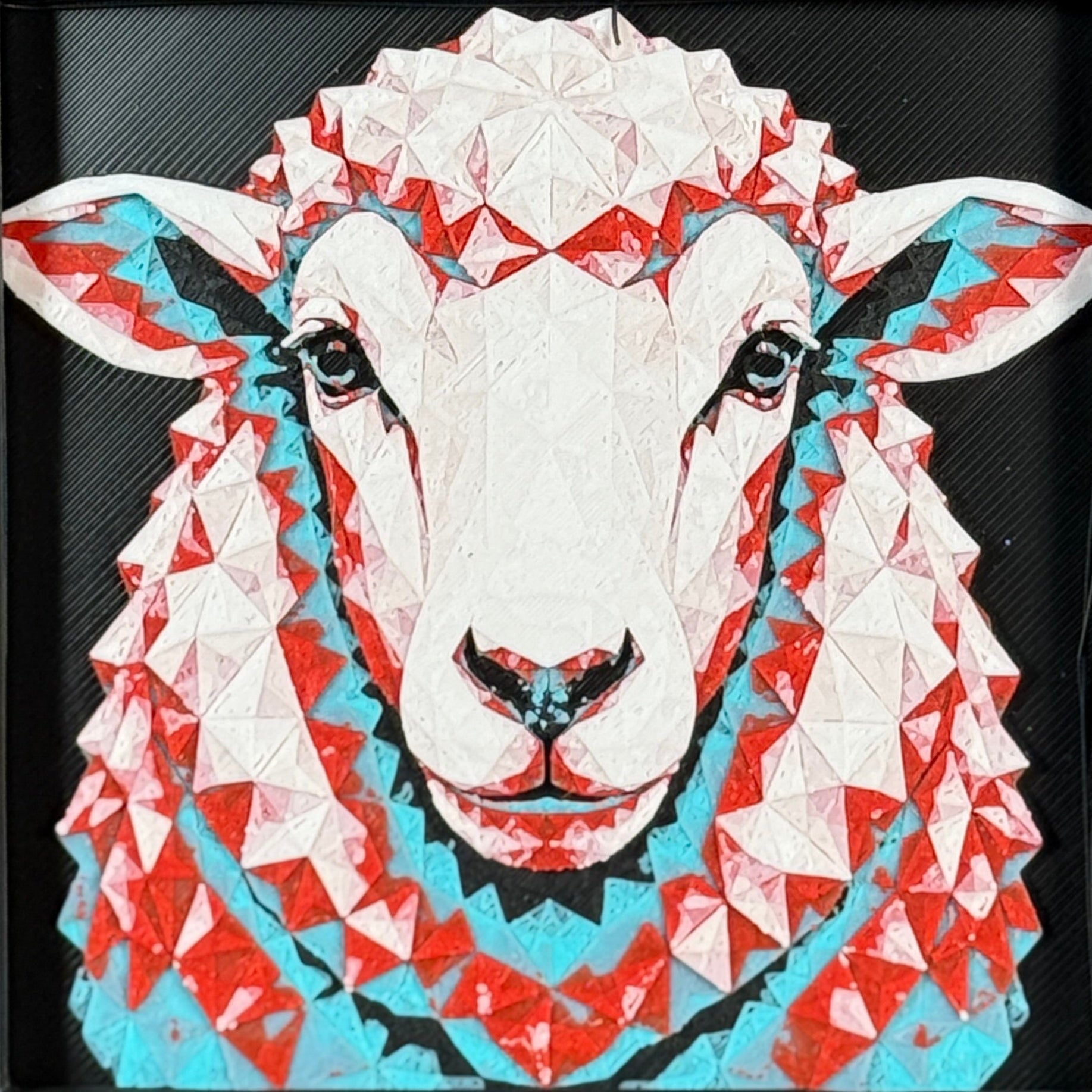 Geometric sheep framed layered 3D art in Crimson Ice color palette, featuring a sheep portrait with cyan, red, black, and white layered details inside a charcoal matte display frame.