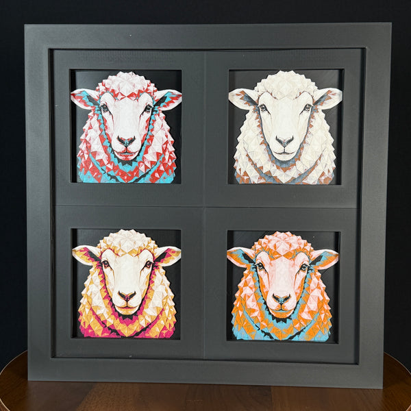 Four-panel framed geometric sheep layered art set showing the same front-facing sheep portrait in four WTX3D color palettes, arranged in a charcoal black 2x2 frame with textured wool detail, bright facial features, and high-contrast layered color.