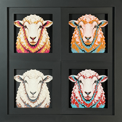 Four-panel framed geometric sheep layered art set showing the same front-facing sheep portrait in four WTX3D color palettes, arranged in a charcoal black 2x2 frame with textured wool detail, bright facial features, and high-contrast layered color.