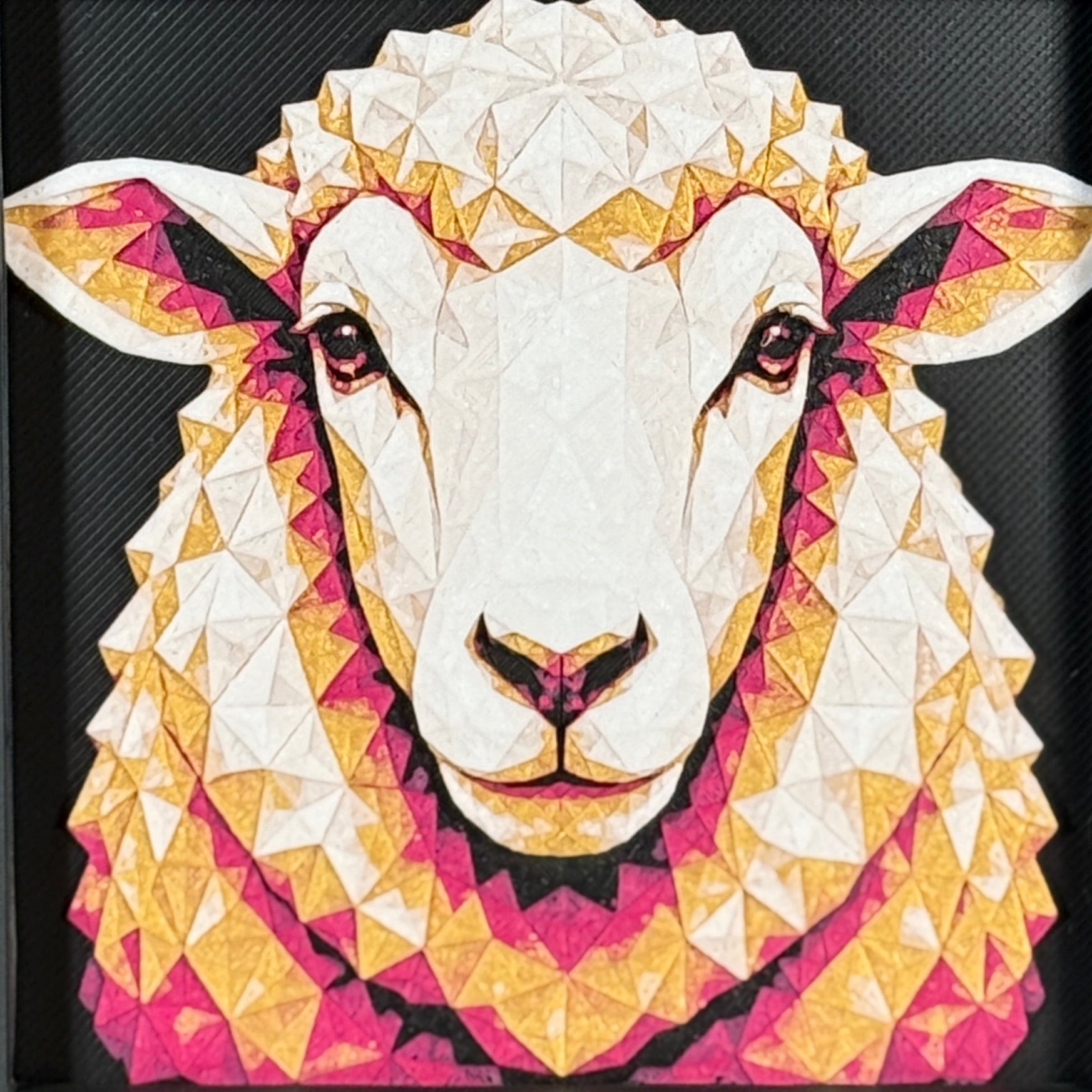 Geometric sheep framed layered 3D art in Royal Gold color palette, featuring a sheep portrait with gold, blue, black, and white layered details inside a charcoal matte display frame.